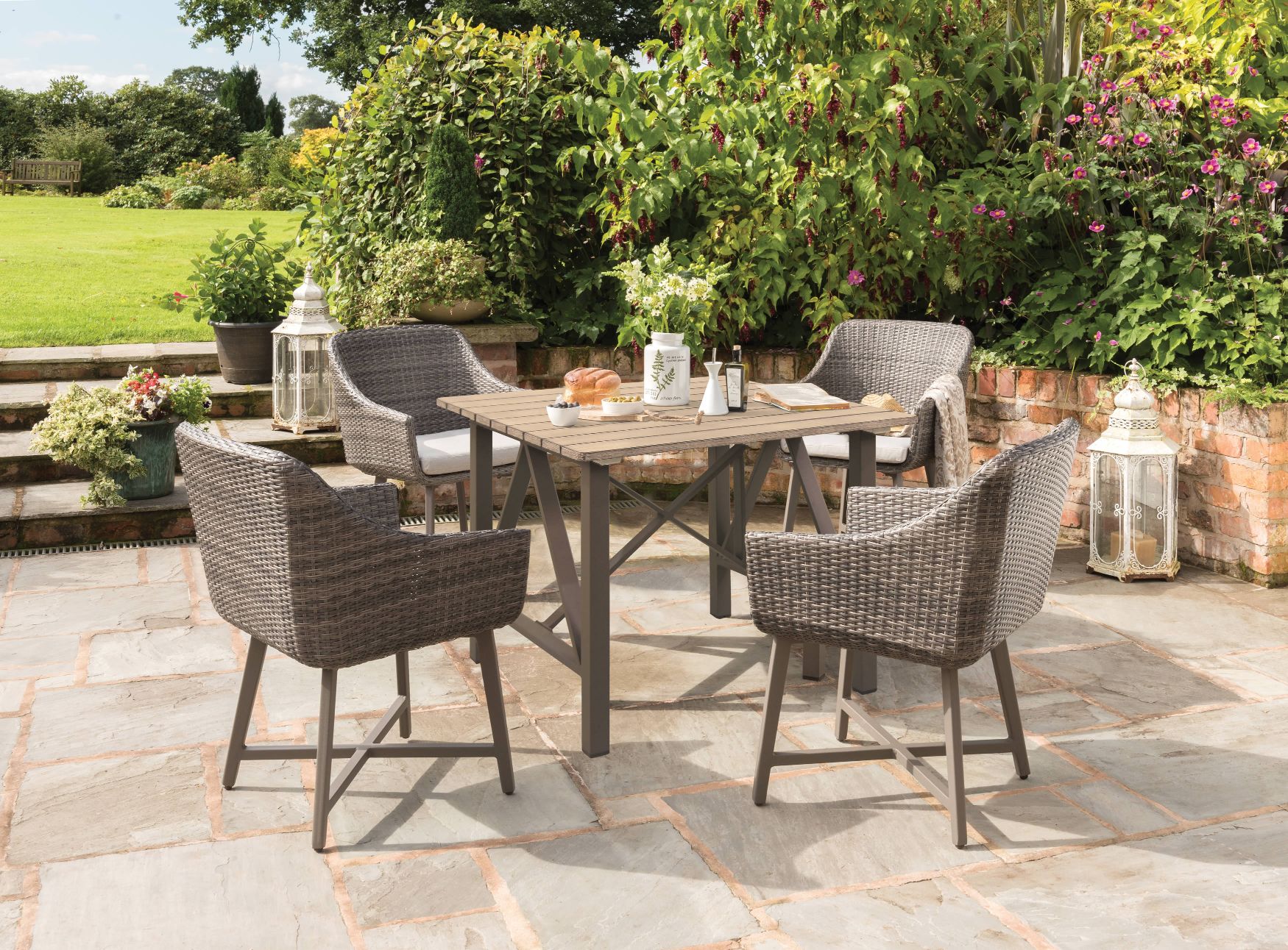 https://www.gardenfurniture.co.uk/wp-content/uploads/2022/11/0296821-3009-Lamode-dining-chair-and-0296825-3009-94x94cm-dining-table-lifestyle-2.jpg